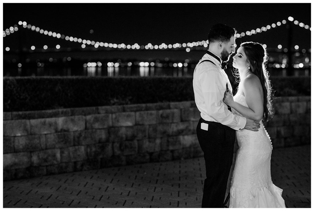 Black and white bride and groom nighttime portrait 