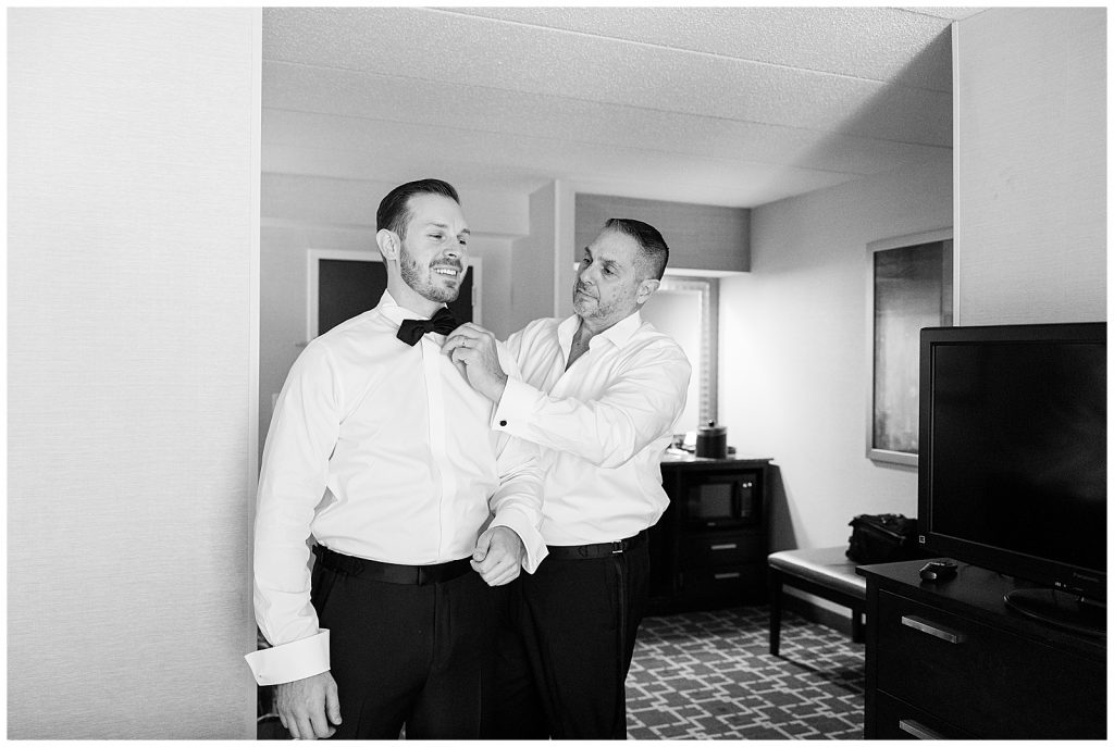 Groom and dad getting dressed
