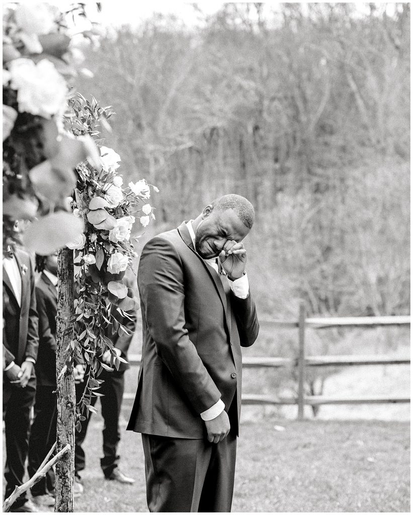 Groom crying at the altar